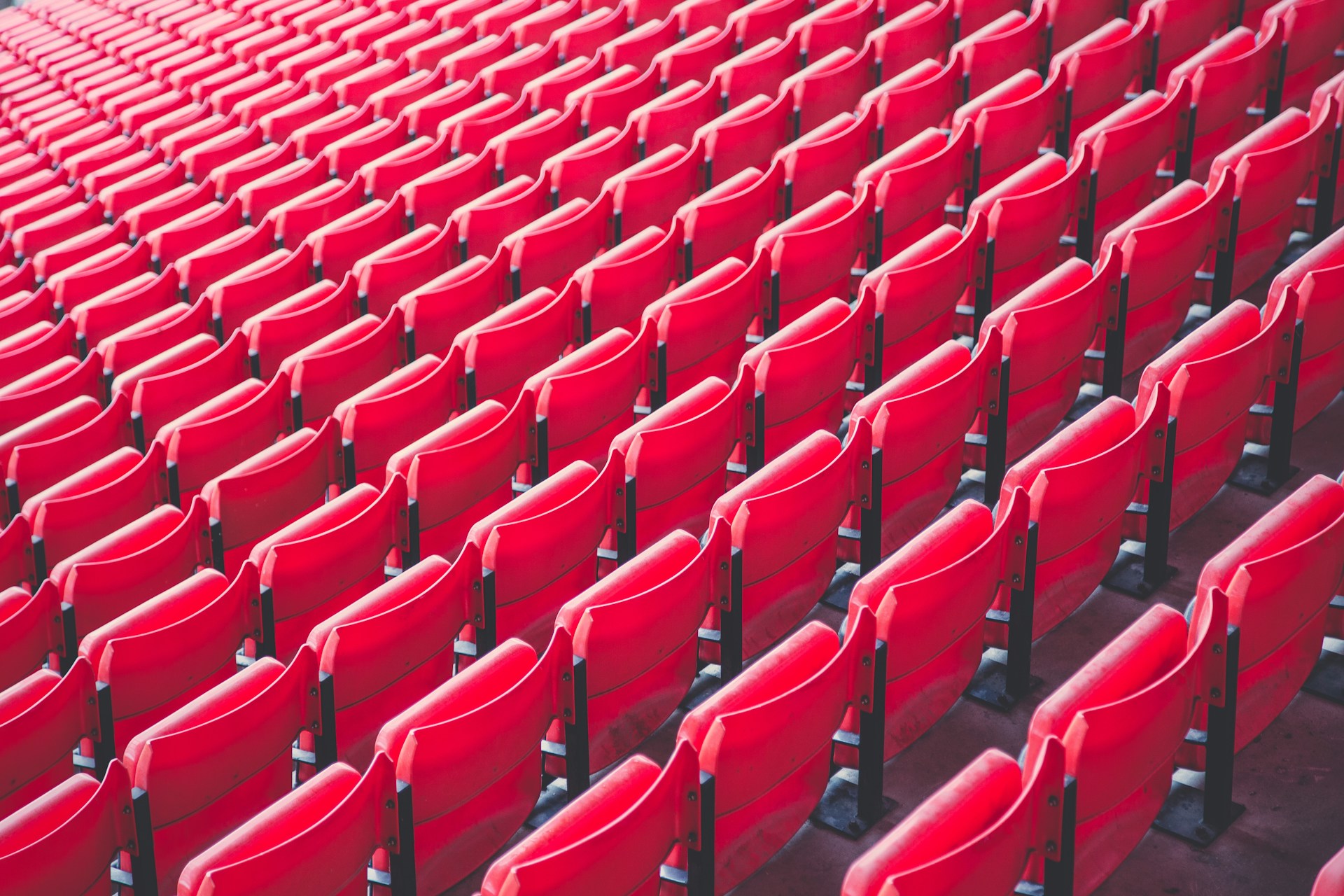 A picture of red seats at Anfield stadium in Liverpool.